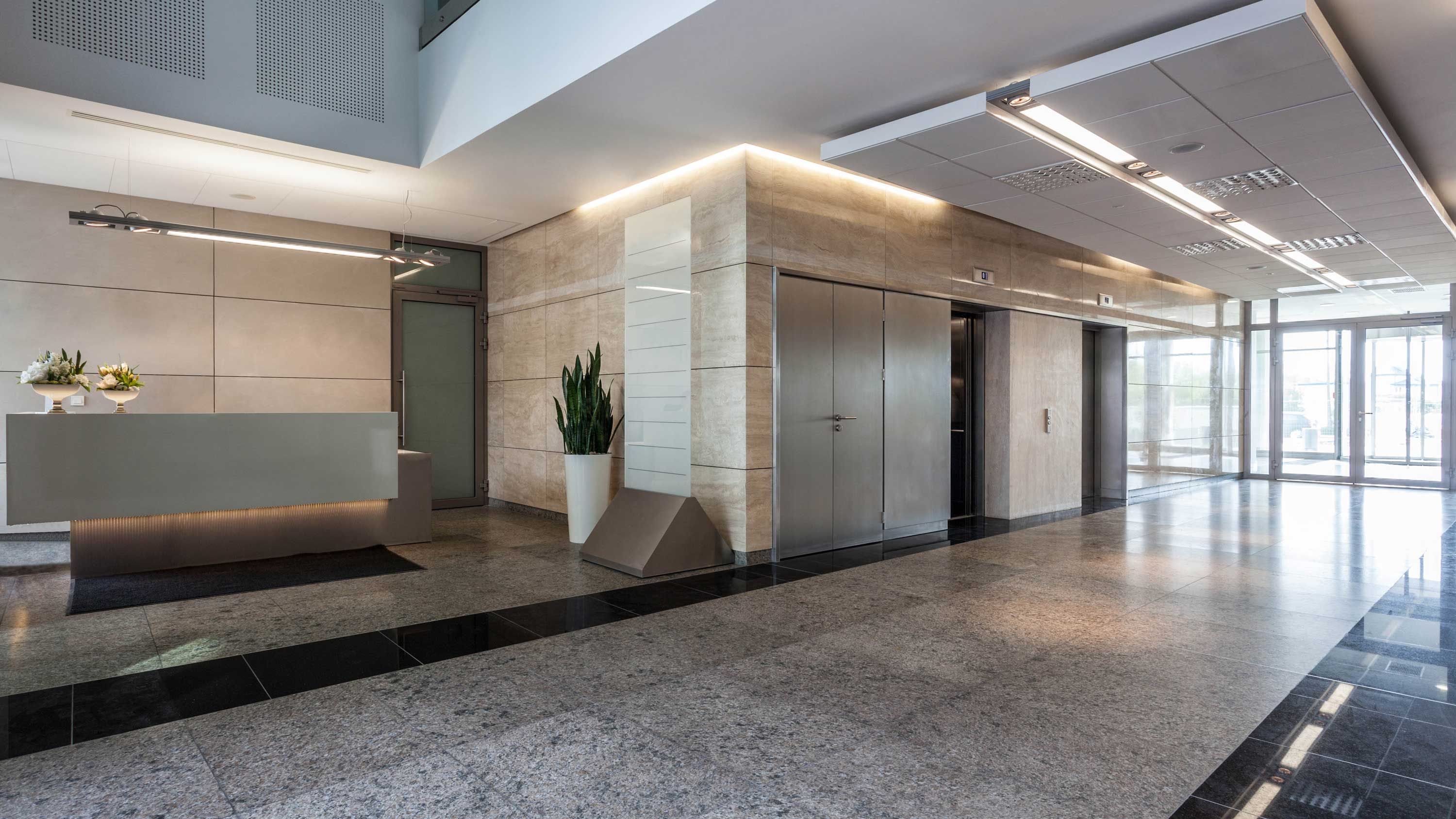 A generic commercial lobby with concrete floors and walls