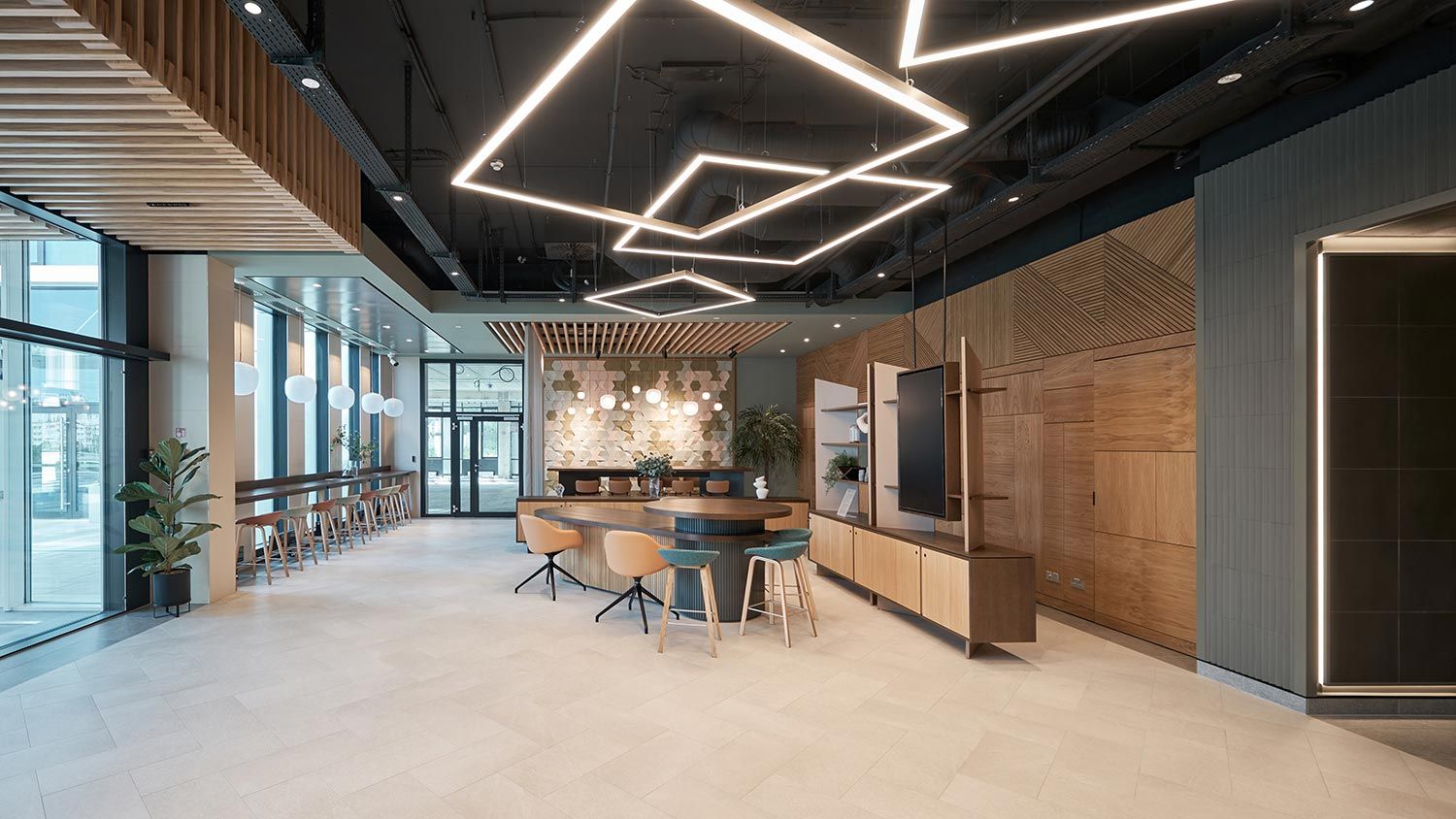 Office informal huddle room with bright geometric lighting fixtures
